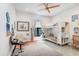Bright bedroom featuring a bunk bed, chair, musical instruments, and a gray rug at 3440 Crenshaw Lake Rd, Lutz, FL 33548