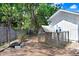 The outdoor chicken coop provides a secure and functional space for poultry in a backyard setting at 3440 Crenshaw Lake Rd, Lutz, FL 33548