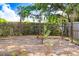 A secure chicken coop sits within a fenced enclosure, providing a safe and natural environment for chickens at 3440 Crenshaw Lake Rd, Lutz, FL 33548