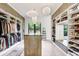 A functional walk-in closet with well-organized shelves and drawers, offering ample storage space at 3440 Crenshaw Lake Rd, Lutz, FL 33548
