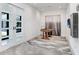 Game room area with a foosball table, gray concrete floor, and sliding glass doors at 3440 Crenshaw Lake Rd, Lutz, FL 33548