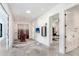 Hallway with recessed lighting, an accent rug, and access to multiple rooms, offering a view of a TV room at 3440 Crenshaw Lake Rd, Lutz, FL 33548