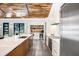 Stylish kitchen showcases a large island, stainless steel appliances, and modern white cabinetry at 3440 Crenshaw Lake Rd, Lutz, FL 33548