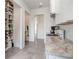 A portion of the kitchen features stainless steel appliances, granite countertops, and custom storage at 3440 Crenshaw Lake Rd, Lutz, FL 33548