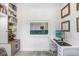 Home office with built-in shelving, a modern desk setup, and natural light at 3440 Crenshaw Lake Rd, Lutz, FL 33548