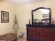 Bedroom features a dresser with decor items and a mirror, creating a cozy and inviting atmosphere at 3505 Tarpon Woods Blvd # P408, Palm Harbor, FL 34685