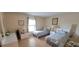 Serene bedroom featuring two beds, neutral decor, and natural light at 3505 Tarpon Woods Blvd # P408, Palm Harbor, FL 34685