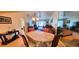 Dining room features a table with chairs, chandelier, and a view of the living room, creating a welcoming space at 3505 Tarpon Woods Blvd # P408, Palm Harbor, FL 34685
