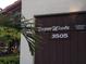 Exterior view of the home's address and signage, showcasing a well-maintained and inviting entrance at 3505 Tarpon Woods Blvd # P408, Palm Harbor, FL 34685