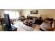 Inviting living room with comfortable seating, a decorative rug, bright window and natural light at 3505 Tarpon Woods Blvd # P408, Palm Harbor, FL 34685