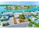 Beautiful waterfront property with lush landscaping, private dock, and serene water views at 365 La Hacienda Dr, Indian Rocks Beach, FL 33785