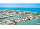 Stunning aerial view of beachfront homes with private docks and ocean access in a desirable coastal community at 365 La Hacienda Dr, Indian Rocks Beach, FL 33785