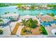 A scenic view of the property featuring waterfront access and lush tropical landscaping at 365 La Hacienda Dr, Indian Rocks Beach, FL 33785