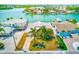 Stunning waterfront home with a private dock and lush tropical landscaping at 365 La Hacienda Dr, Indian Rocks Beach, FL 33785
