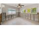 Bright bedroom with tiled flooring and abundant natural light from several large windows at 365 La Hacienda Dr, Indian Rocks Beach, FL 33785
