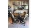 Dining area with seating for four overlooking the kitchen with plenty of natural light and tile floors at 365 La Hacienda Dr, Indian Rocks Beach, FL 33785