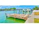 Waterfront dock with boat lift offering scenic views and access to the water at 365 La Hacienda Dr, Indian Rocks Beach, FL 33785