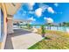 Covered patio with a ceiling fan offering views of the waterfront and private dock at 365 La Hacienda Dr, Indian Rocks Beach, FL 33785