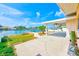 Covered patio overlooking the waterfront and private dock, perfect for relaxing at 365 La Hacienda Dr, Indian Rocks Beach, FL 33785
