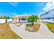 Attractive home showcasing a manicured front yard, walkway, and patio at 365 La Hacienda Dr, Indian Rocks Beach, FL 33785
