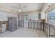 Renovation-ready kitchen with stainless steel refrigerator, white cabinets, and tiled floor, awaiting personalization and modern updates at 365 La Hacienda Dr, Indian Rocks Beach, FL 33785