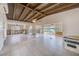 Expansive living room with vaulted wood ceilings and large windows with water views at 365 La Hacienda Dr, Indian Rocks Beach, FL 33785