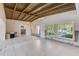 Open living room area featuring tile floors, ceiling fan, and natural light at 365 La Hacienda Dr, Indian Rocks Beach, FL 33785