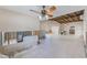 Large living room with high ceilings, tile flooring, and incomplete walls offering customization potential at 365 La Hacienda Dr, Indian Rocks Beach, FL 33785