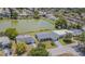 Aerial view of home with lake view and beautiful neighborhood at 4014 Pleasant Ridge Dr, New Port Richey, FL 34652