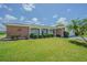 Charming single-story home with well-manicured lawn, mature landscaping and brick accents at 4014 Pleasant Ridge Dr, New Port Richey, FL 34652