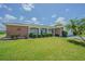 Charming single-story home with well-manicured lawn, mature landscaping and brick accents at 4014 Pleasant Ridge Dr, New Port Richey, FL 34652