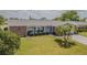 Inviting single-story home with a beautifully landscaped front yard at 4014 Pleasant Ridge Dr, New Port Richey, FL 34652