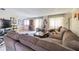 Spacious living room featuring a large sectional sofa and lots of natural light at 4014 Pleasant Ridge Dr, New Port Richey, FL 34652