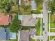 An aerial view shows the property's lot size, landscaping, driveway, and proximity to other homes at 4206 W Sevilla St, Tampa, FL 33629