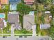 An aerial view showcases the home's backyard, neighborhood, and surrounding mature trees at 4206 W Sevilla St, Tampa, FL 33629