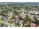 An aerial view of the neighborhood reveals mature trees, and surrounding properties with green lawns at 4206 W Sevilla St, Tampa, FL 33629