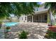 Backyard features a pool, patio area, beautiful landscaping, and a screened-in porch at 4206 W Sevilla St, Tampa, FL 33629