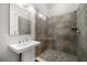 Beautiful bathroom features a stylish shower with glass door and a vessel sink with modern fixtures at 4206 W Sevilla St, Tampa, FL 33629