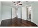 This spacious bedroom features hardwood floors, ceiling fan and fresh, light blue paint at 4206 W Sevilla St, Tampa, FL 33629