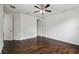This bright bedroom has hardwood floors, ceiling fan and neutral, white paint at 4206 W Sevilla St, Tampa, FL 33629