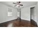 This spacious bedroom features hardwood floors, white paint and natural light at 4206 W Sevilla St, Tampa, FL 33629
