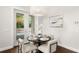 Bright breakfast nook featuring a round table, stylish seating, and view of the outdoor pool at 4206 W Sevilla St, Tampa, FL 33629