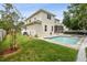 Exterior view of a two-story home with a pool and landscaped backyard at 4206 W Sevilla St, Tampa, FL 33629