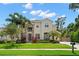 Charming two-story home with stone accents, mature trees, and a well-maintained lawn at 4206 W Sevilla St, Tampa, FL 33629