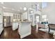 Bright, open-concept kitchen with stainless steel appliances, white cabinets and dark hardwood floors at 4206 W Sevilla St, Tampa, FL 33629