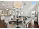 Bright living room featuring a contemporary light fixture, high ceilings, and modern furnishings at 4206 W Sevilla St, Tampa, FL 33629