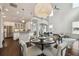 Bright, open-concept living room with a soaring ceiling, kitchen, and dining area at 4206 W Sevilla St, Tampa, FL 33629