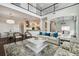 Bright living room featuring high ceilings, modern furnishings, and an open floor plan at 4206 W Sevilla St, Tampa, FL 33629