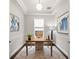 Bright office featuring a desk, a large window, stylish decor, and hardwood floors at 4206 W Sevilla St, Tampa, FL 33629