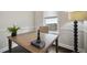 Home office with natural lighting, a comfortable chair, and dark wood floors at 4206 W Sevilla St, Tampa, FL 33629
